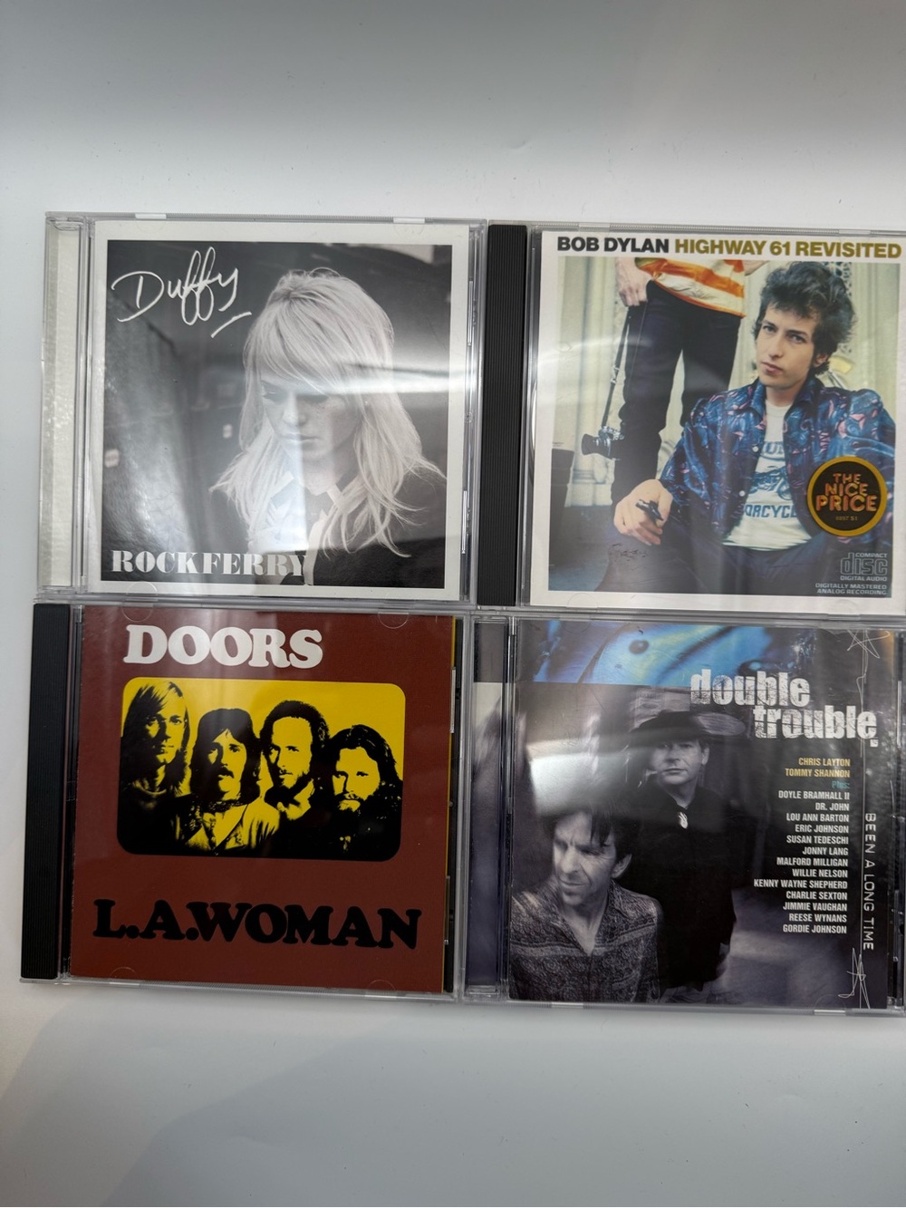 Lot of 4 CDs: The Doors, Bob Dylan,
Duffy, Double Trouble
